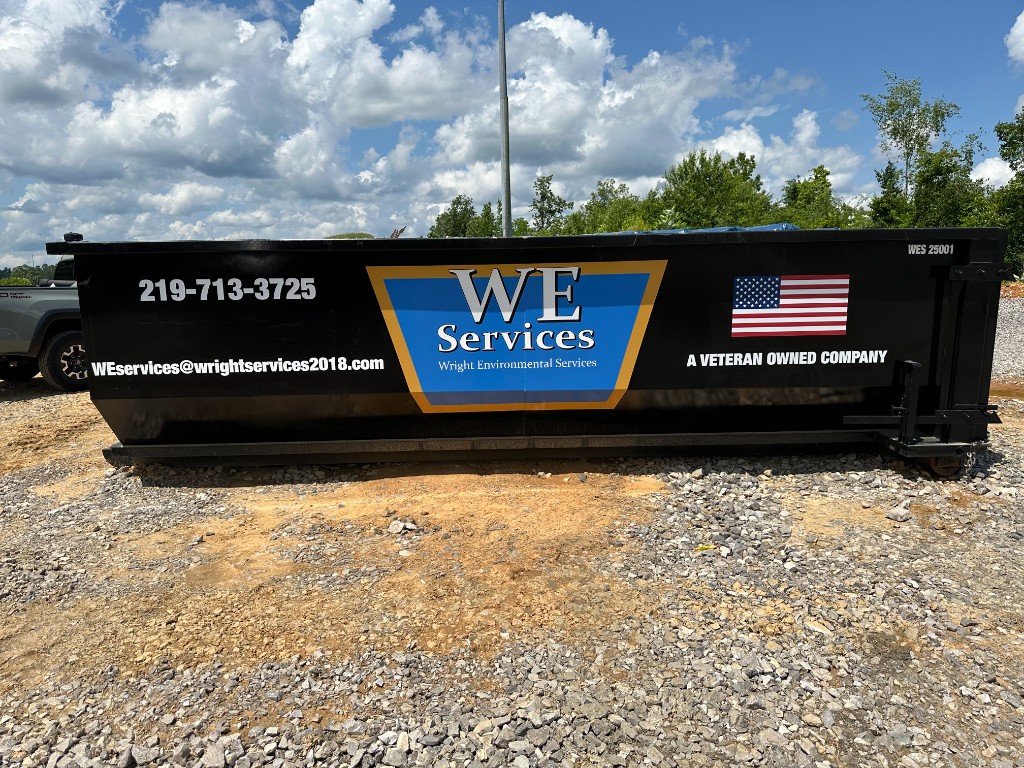 WE Services branded hazardous waste roll-off container